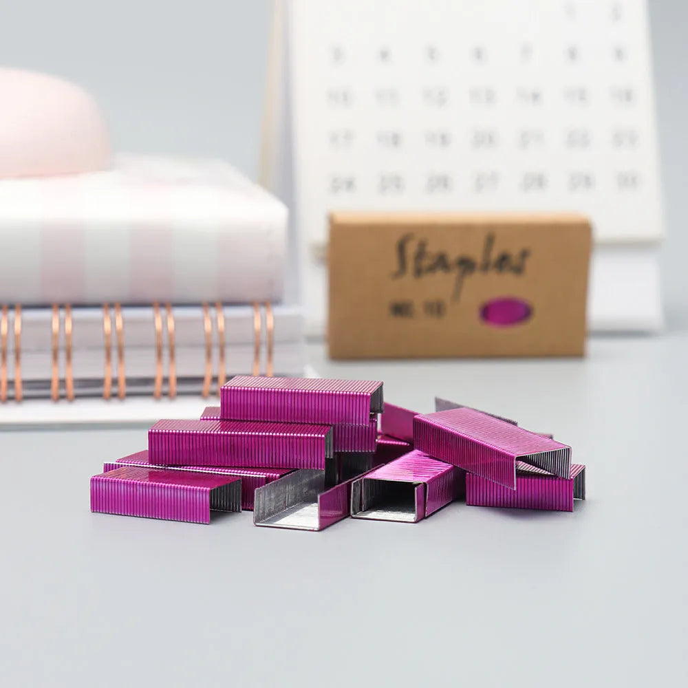Box of 1000 metal stitching needles in black, purple, rose gold, and rose red colours.