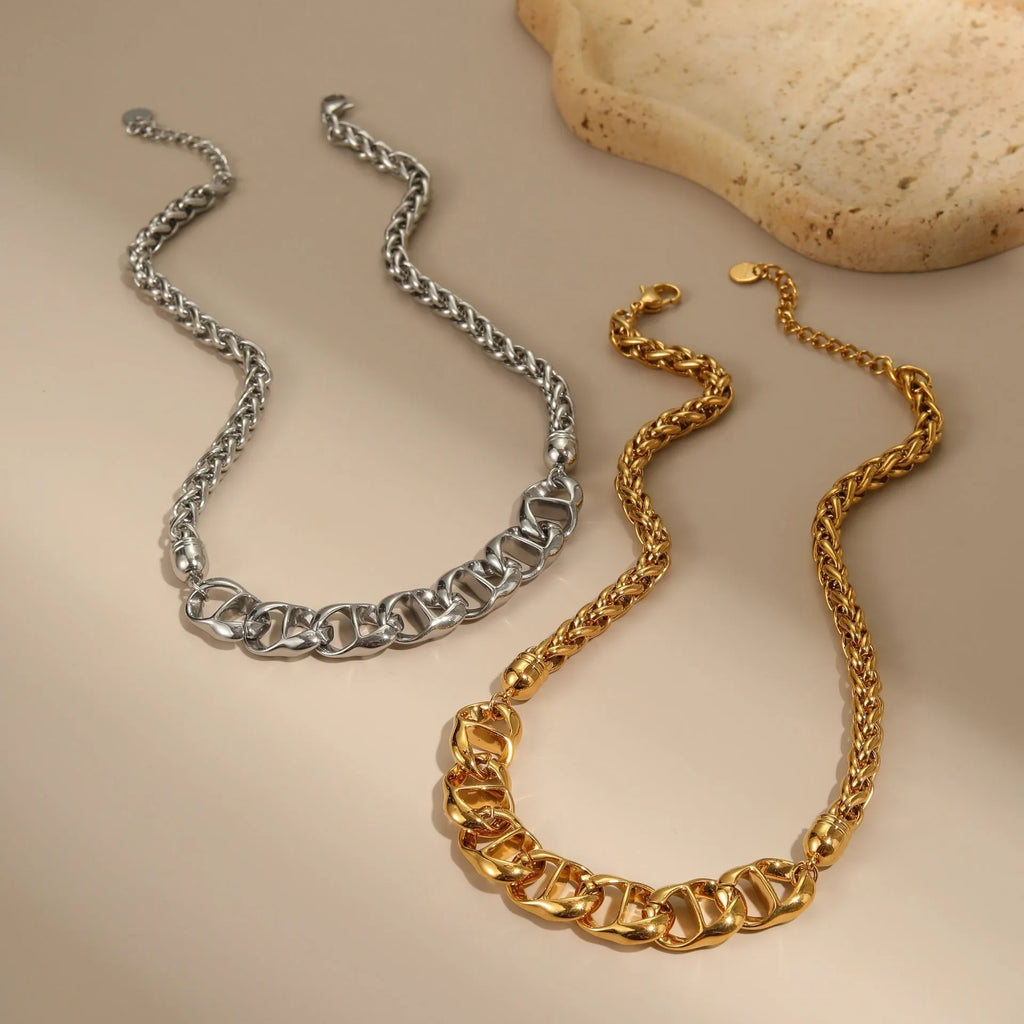 Gold and steel stainless steel geometric pendant necklace with regular chain.