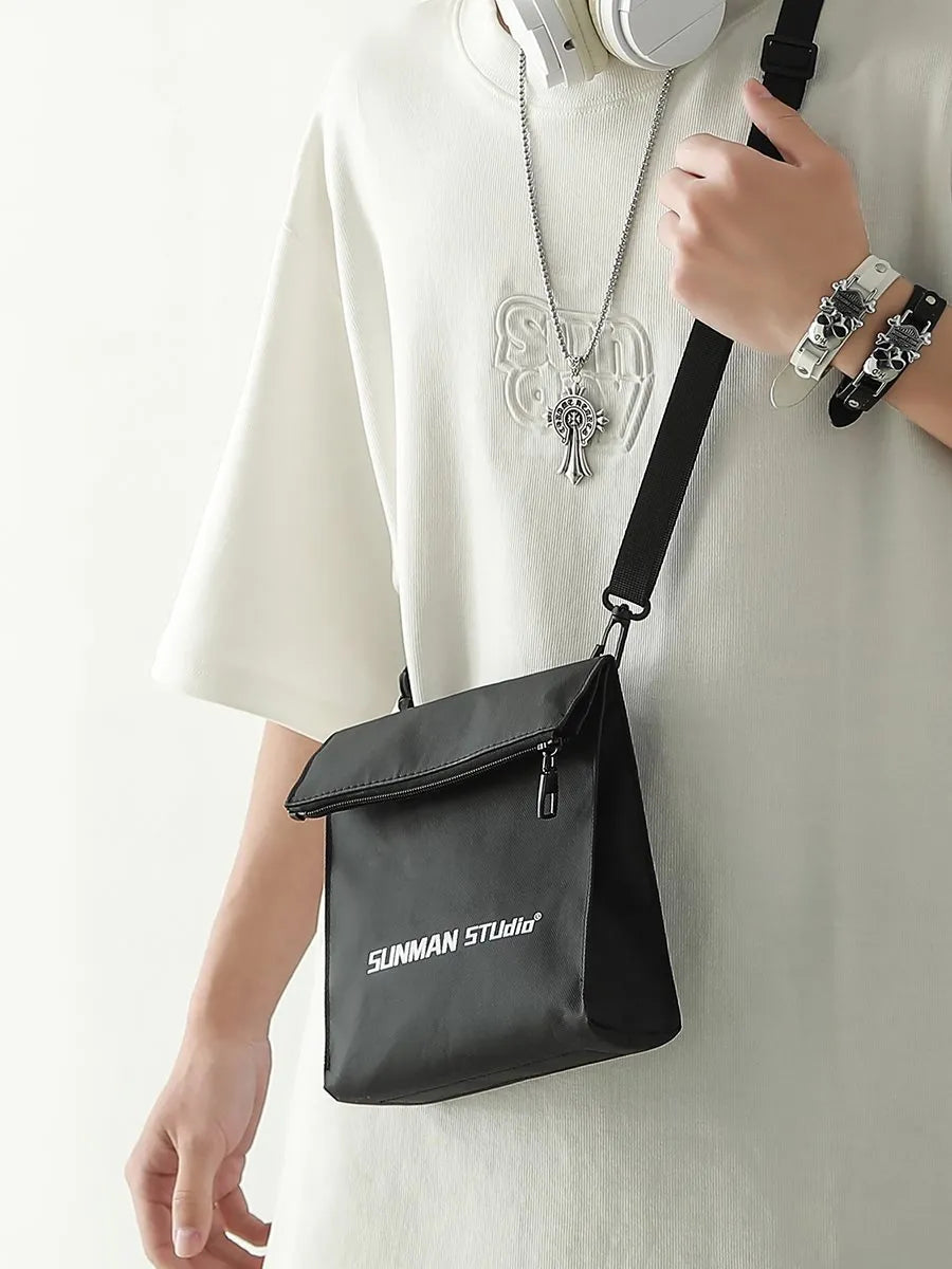 Messenger design backpack in polyester with crossbody strap and sewing line detailing