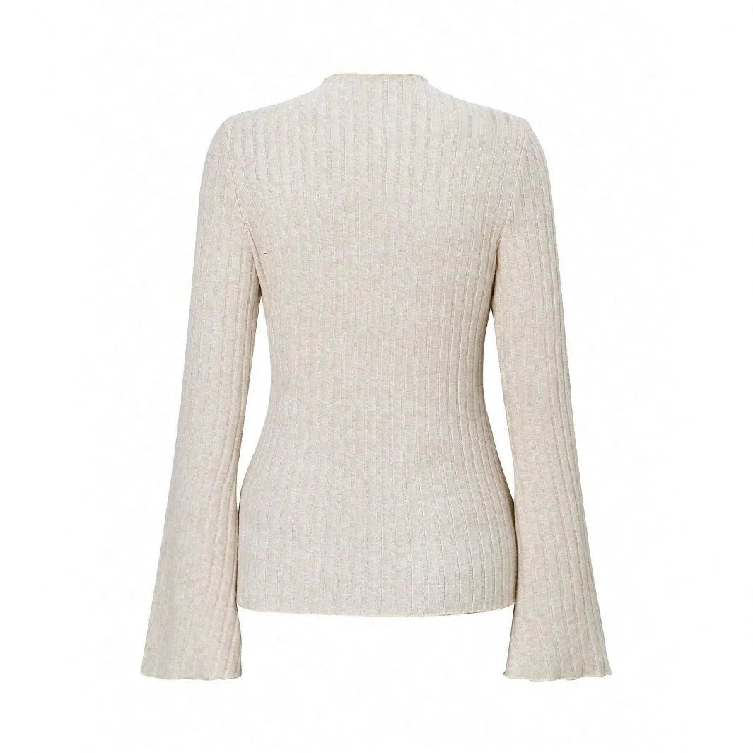 Long sleeve black top with lantern sleeves and sunken stripe texture, laid flat.