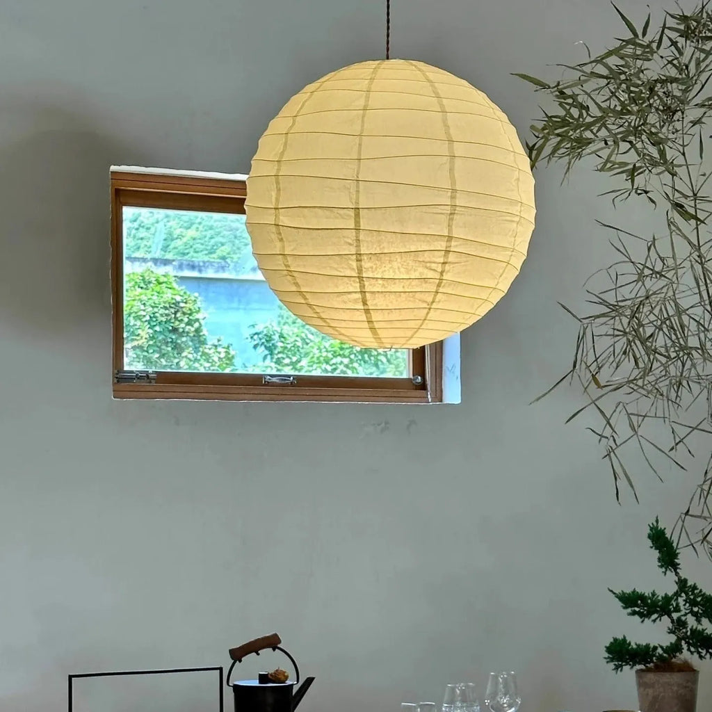 Japanese-style rice paper ball chandelier pendant light in a living room setting.