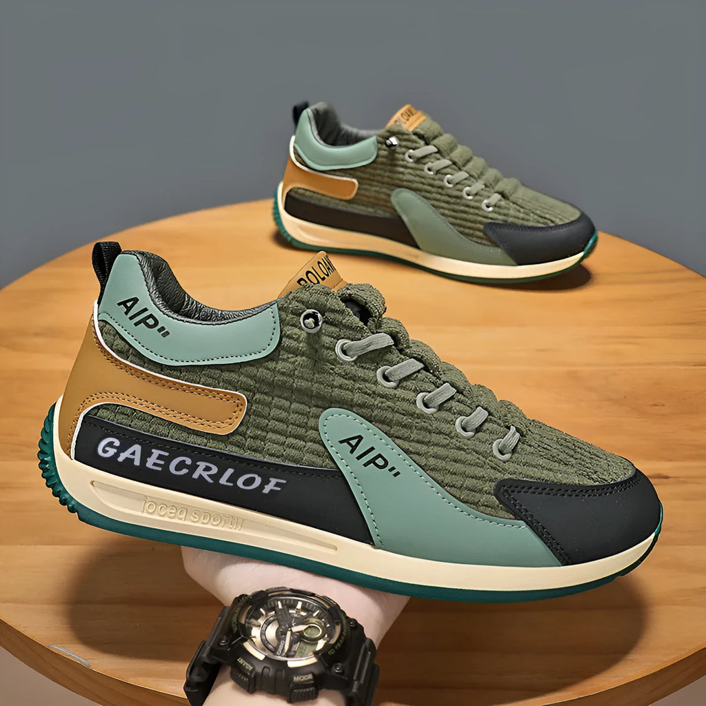 Men's green and grey low-top mesh running shoes with lace-up front and round toe.