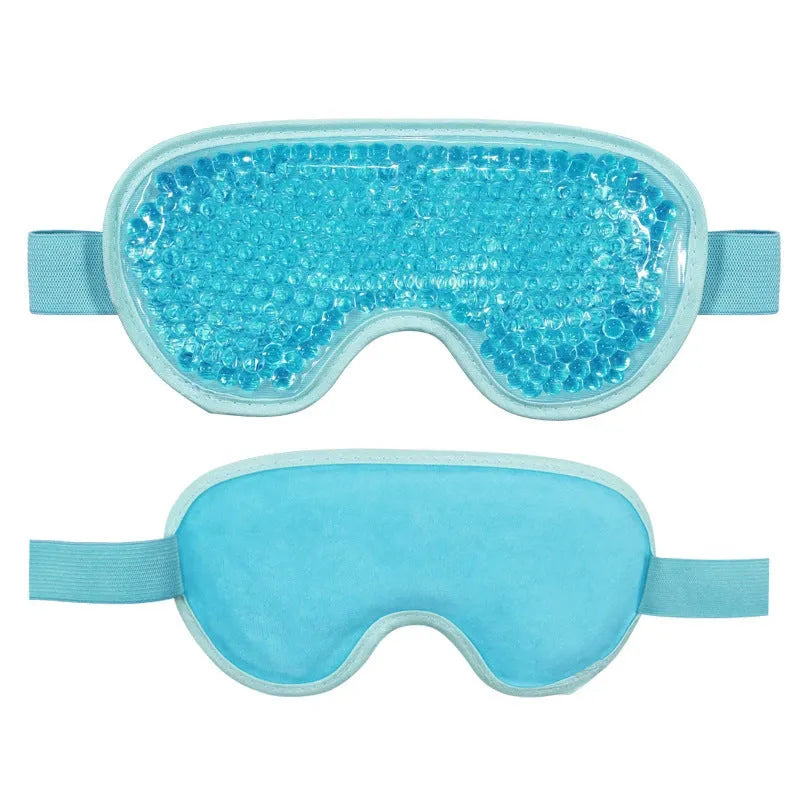 White portable rechargeable hot cold compress eye mask with USB cable and accessories.