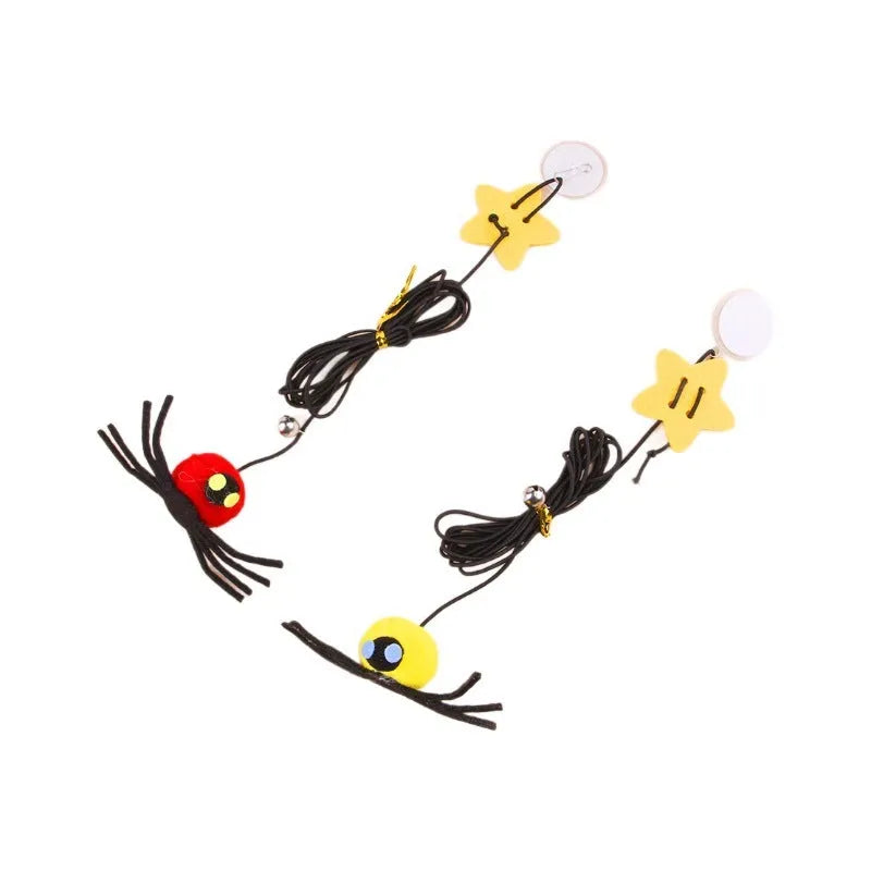 Red or yellow cat toy hanging from door with elastic rope, feathers, bells and spider attachment