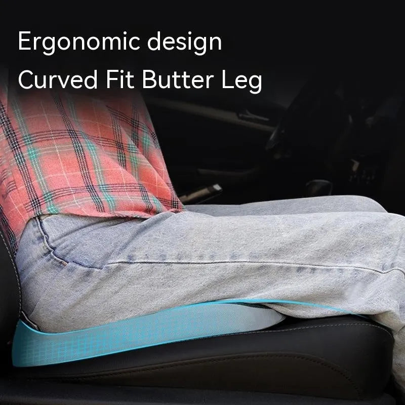 Curved wedge seat cushion for tailbone support in car, shown in beige colour with memory foam interior