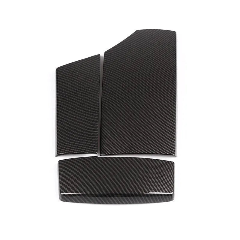 Three black ABS armrest box protective covers with a diagonal carbon fibre weave pattern.