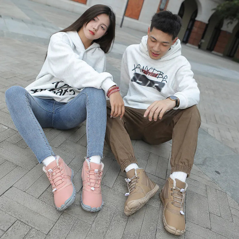 Black unisex waterproof winter snow boots with fleece lining and rubber sole on a wet surface.