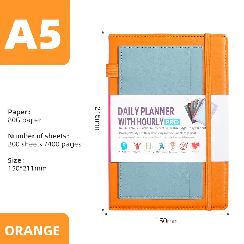 A5 notebook with PU leather cover in matcha green, lying open on a desk