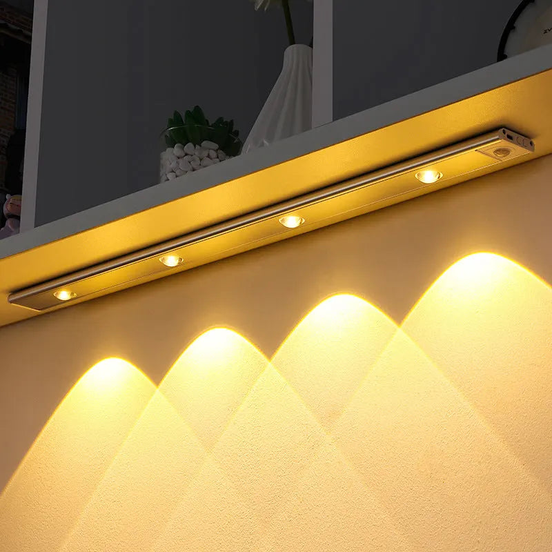 Silver ultra-thin USB rechargeable LED light strip with motion sensor for cabinet mounting.