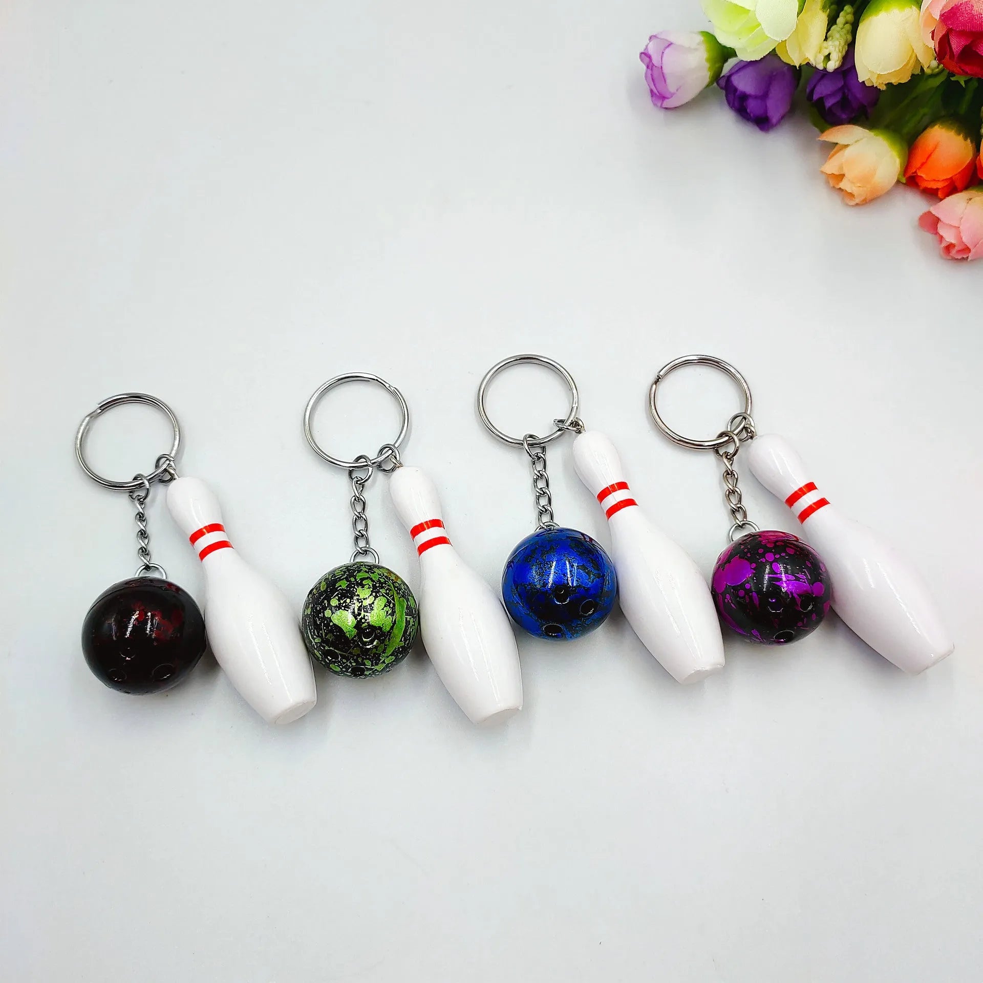 Miniature bowling alley simulation keychain pendant in blue colour with metal key ring