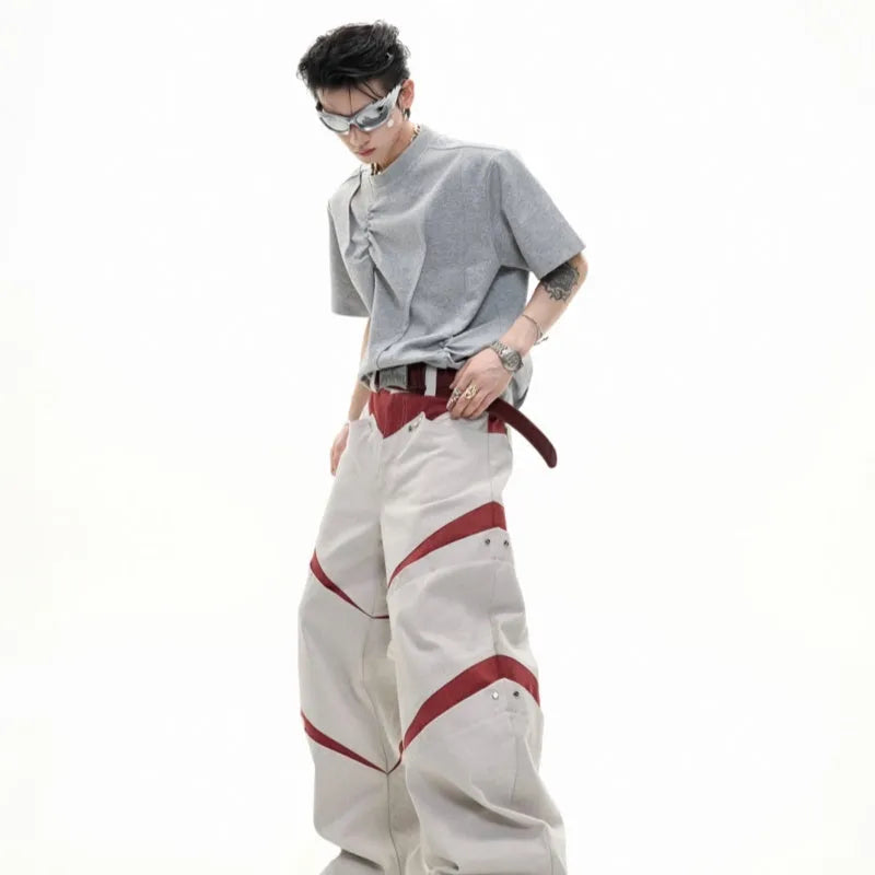 Men's grey pleated cotton t-shirt with round neck and short sleeves on a loose fit model