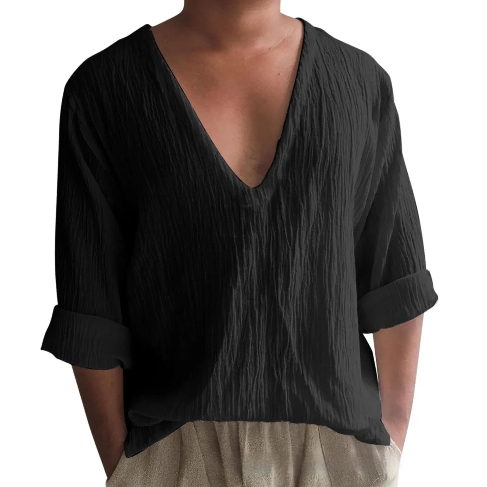 Man wearing a washed cotton long sleeve V-neck t-shirt in a solid colour.