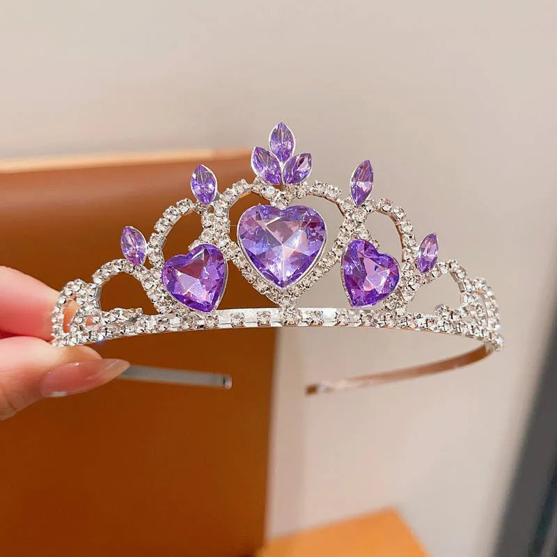 Girl's shiny metal headband with a crystal crown design in pink, light blue, and light purple colours.