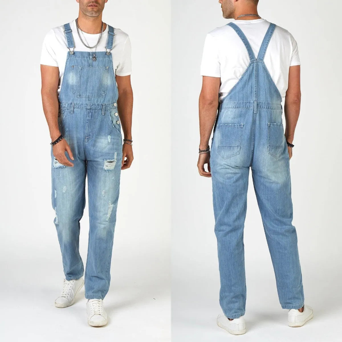 Light blue ripped denim suspender jeans for men on a hanger, showing high waist and button fastenings.