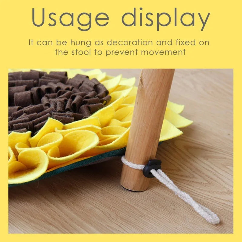 Yellow sunflower-shaped dog snuffle mat with rope and buckle attachment for slow feeding