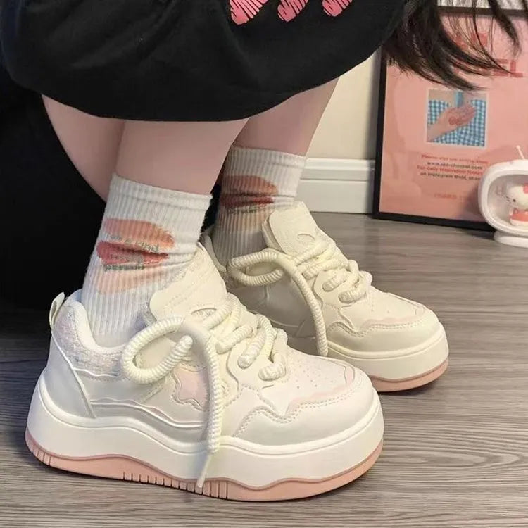 Women's green patent leather platform sneakers with round toe and lace-up closure on rubber sole