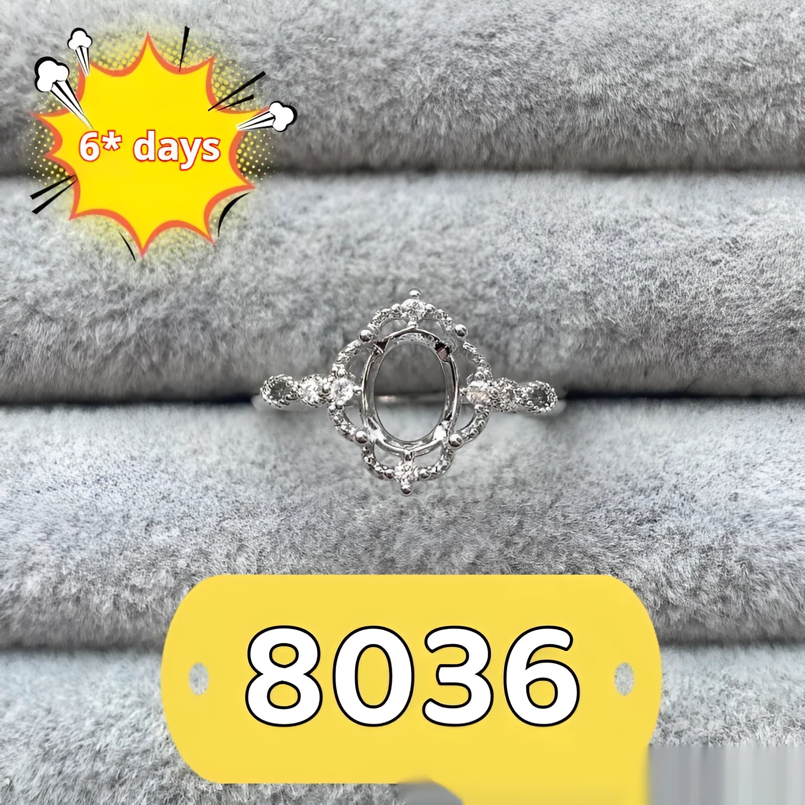 Oval denier fashion ring with open mouth setting, five-pointed star, and 6x8mm stone on copper band.