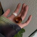 Chinese style geometric resin ring in irregular wide band shape showing three colour options