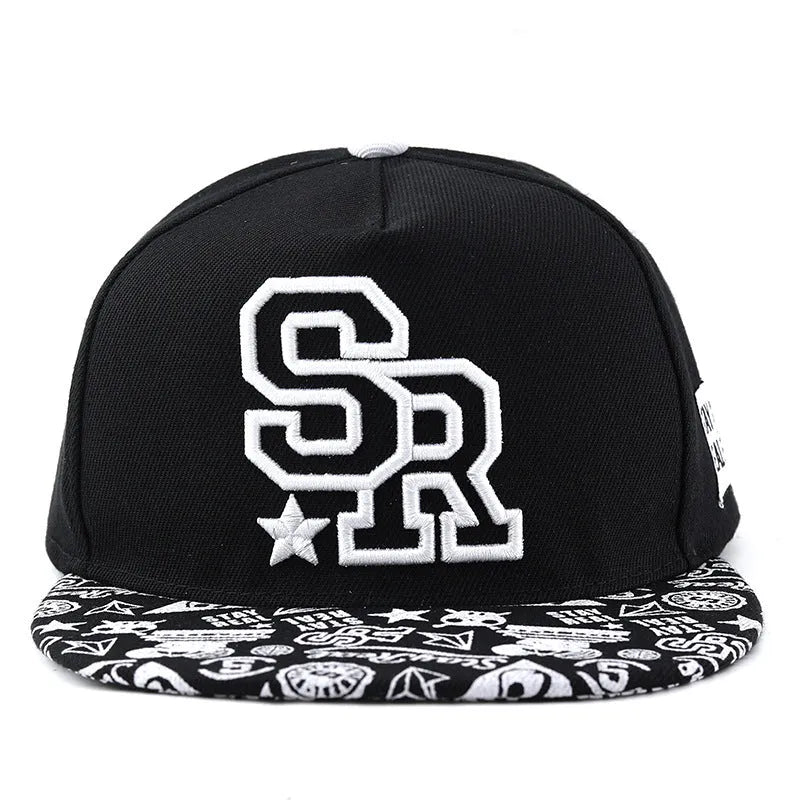 Adjustable black cotton baseball cap with white letter embroidery on the front, showing dome crown shape.