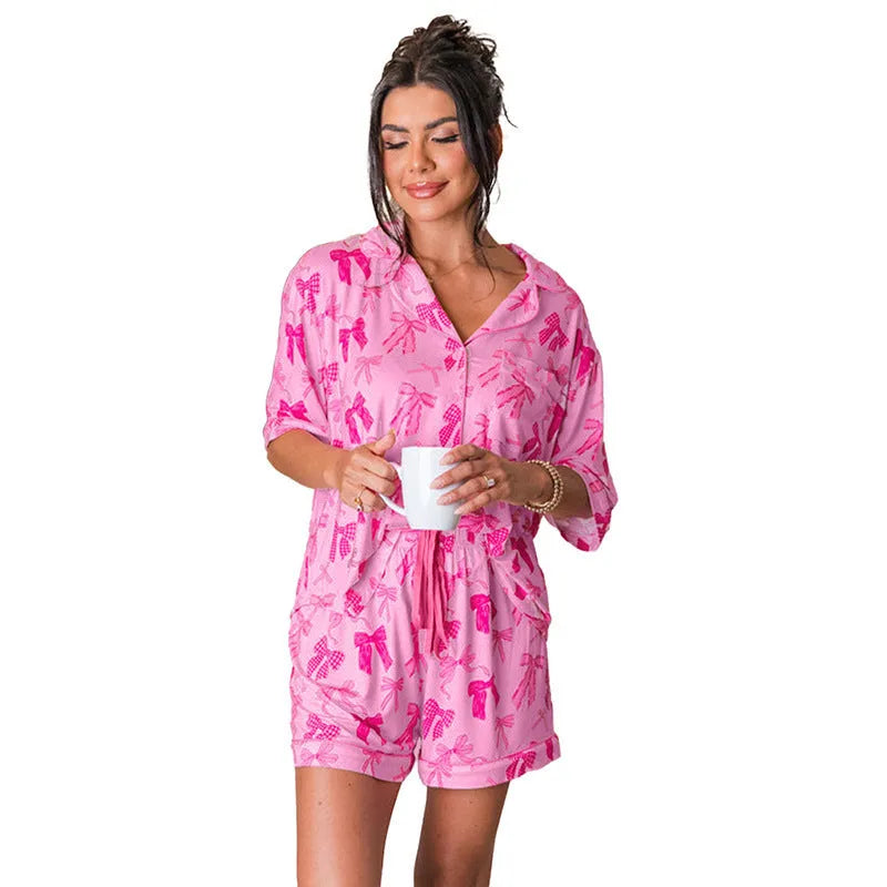 Women's pink bow print two-piece pajama set in lightweight polyester fabric