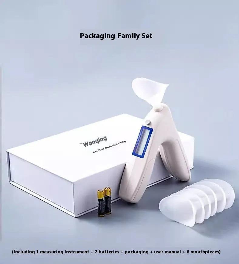 Handheld white spirometer tester with LCD screen and blowing nozzle for lung capacity measurement