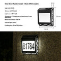 Solar powered waterproof doorplate light with LED address digits in black housing