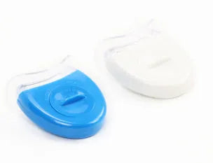 Transparent silicone denture model on a clean surface with natural light showing clear tooth structure