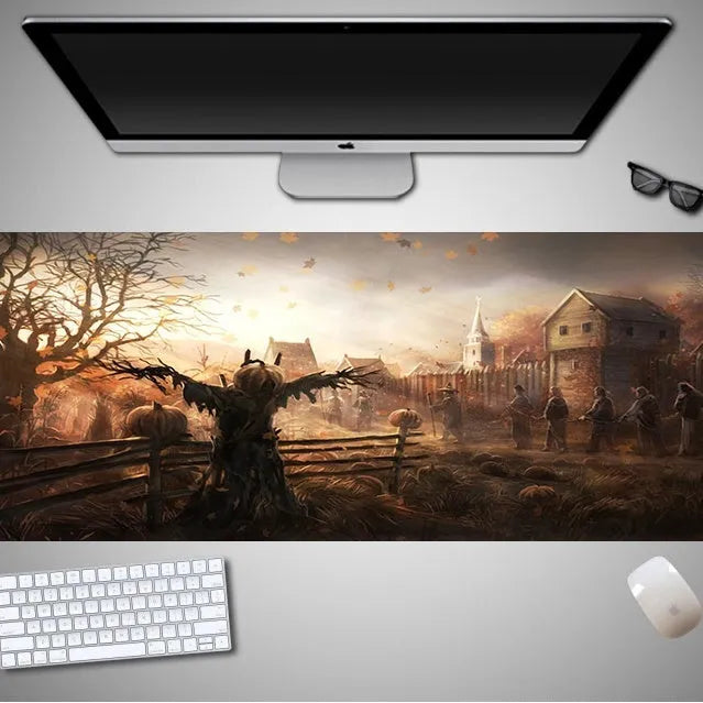 Large Halloween patterned gaming mouse pad on a desk showing non-slip rubber base and extra-long design.