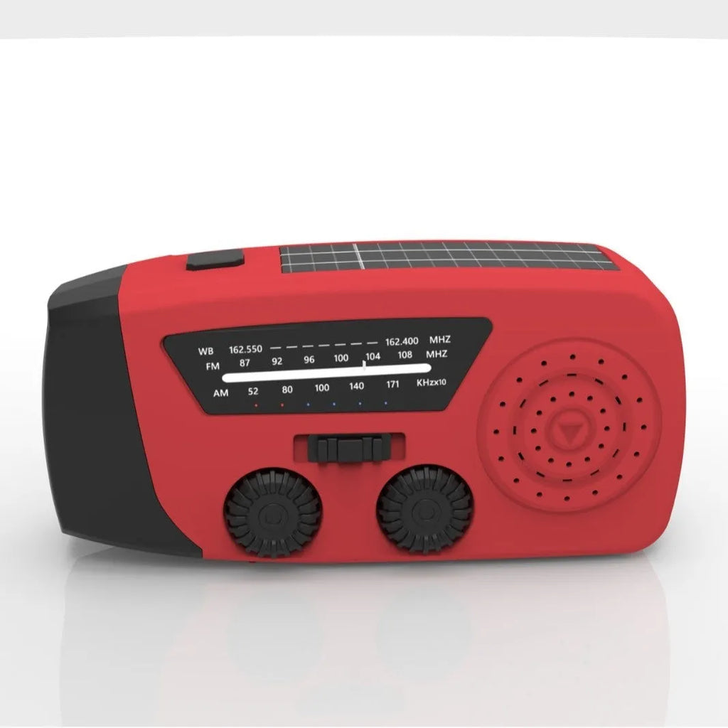 Red rechargeable hand-held emergency radio torch with wrist strap and USB charging port.