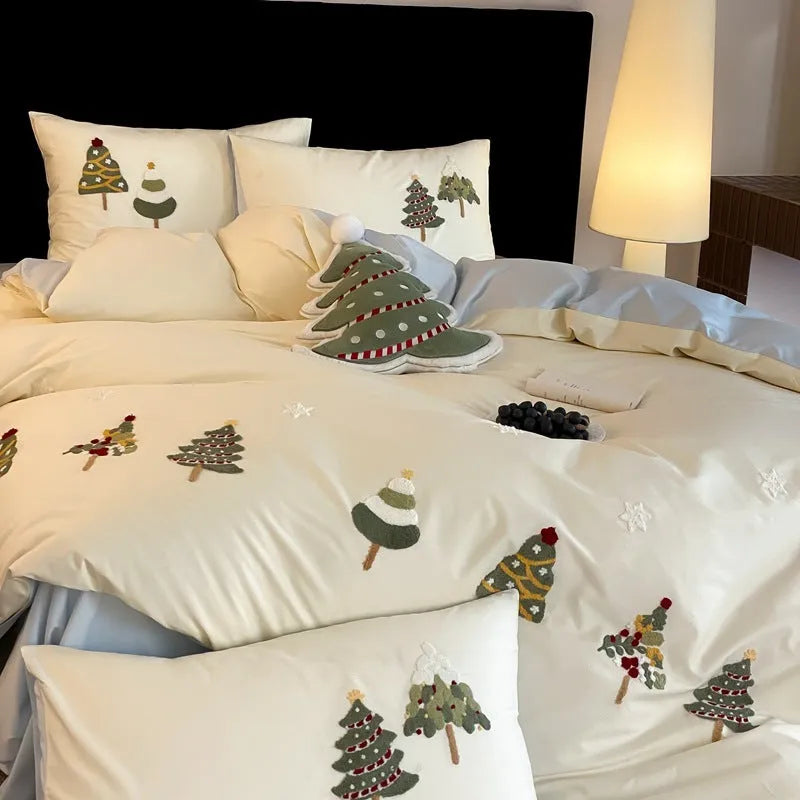 Cream Blue pure cotton duvet cover with raised white Christmas tree embroidery, paired with a fitted sheet and pillowcases.