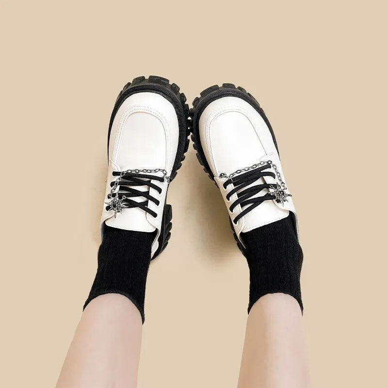 Women's Duke Asterism colour loafers with a metal cross shoulder strap and round toe.