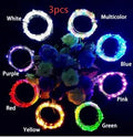 Silver copper wire LED string lights wrapped around wine bottle with 20 white LEDs