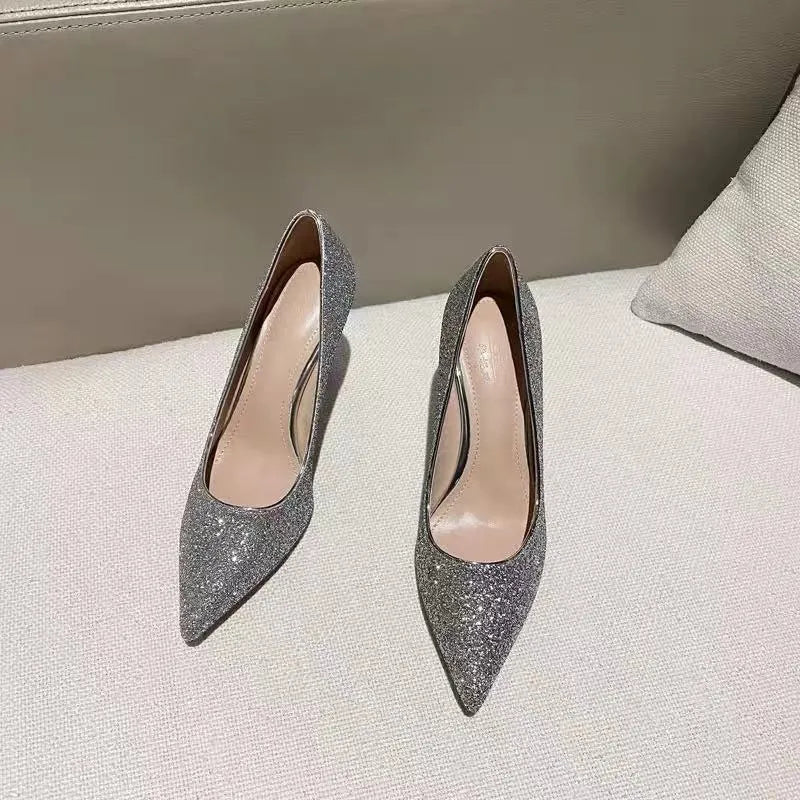 Silver and black women's stiletto wedding shoes with crystal detail on PU leather upper.