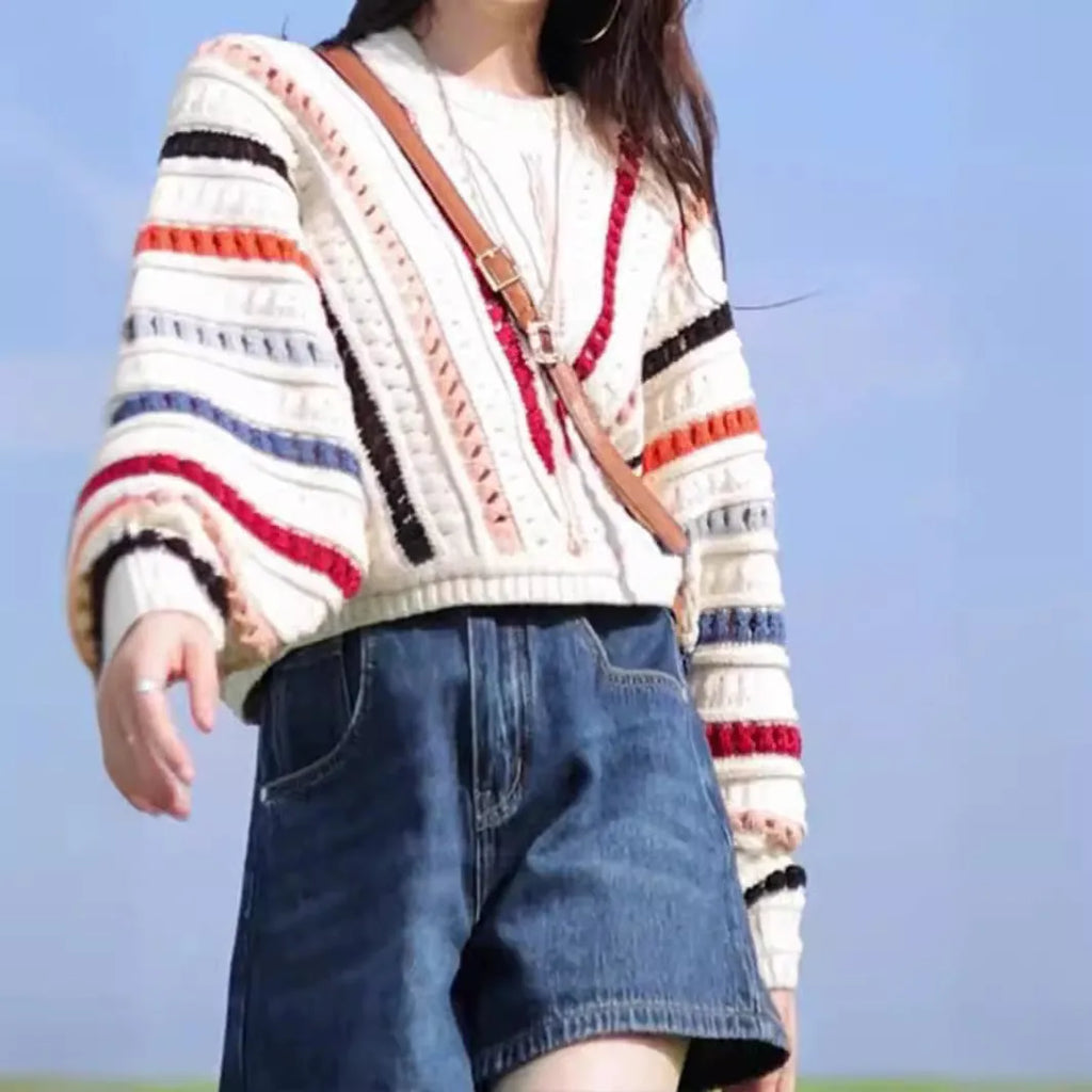 Retro rainbow striped loose sweater with batwing sleeves and a round neck.