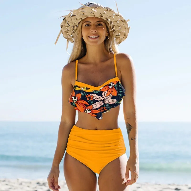 Women's floral print high-waisted bikini swimsuit with pleated pants and briefs top in blue and green colour options