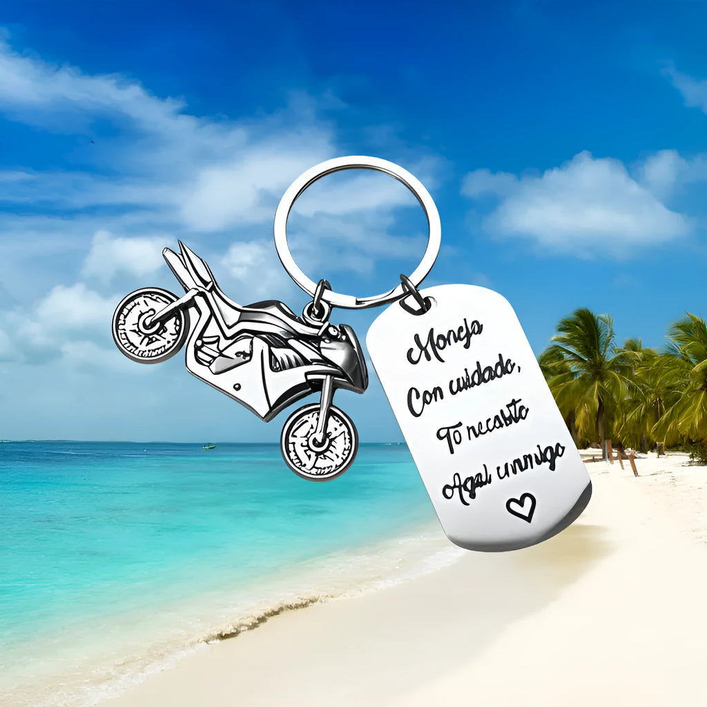 Stainless steel motorcycle-themed keychain with charm and a red flannel storage pouch.