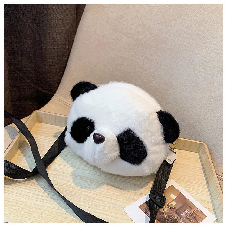 Soft plush cylindrical crossbody bag in Panda Head colour, showing dimensions and sandwich pocket.
