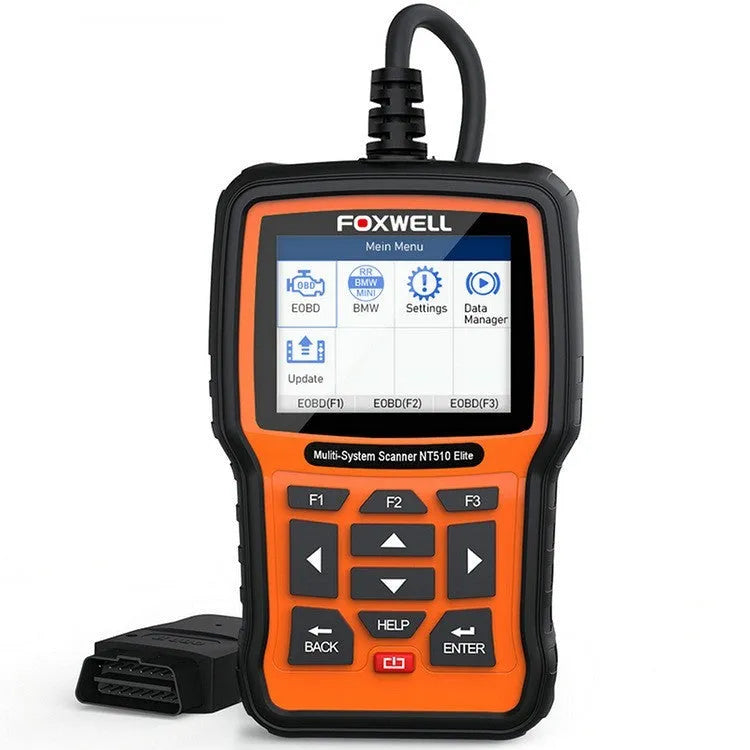 Foxwell NT510 orange and black automotive diagnostic scanner with data cable on a workshop bench.