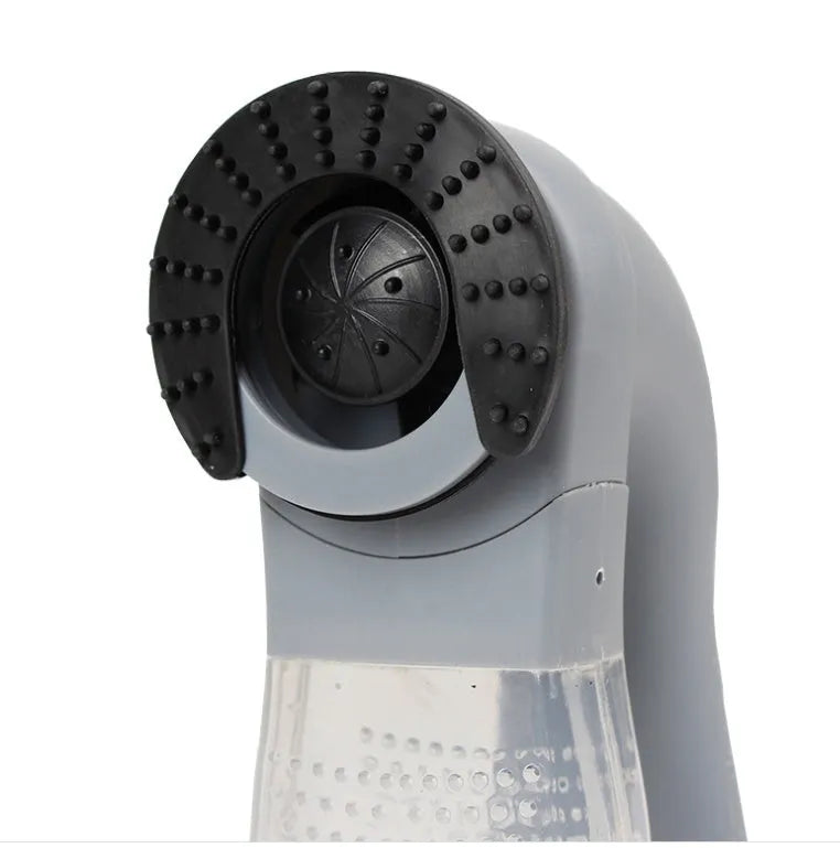 Grey portable electric pet hair removal vacuum with soft rubber grooming head.