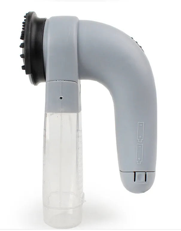 Grey portable electric pet hair removal vacuum with soft rubber grooming head.