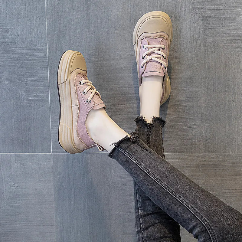 Women's matcha green leather platform sneakers with round toe and white laces on a flat sole.