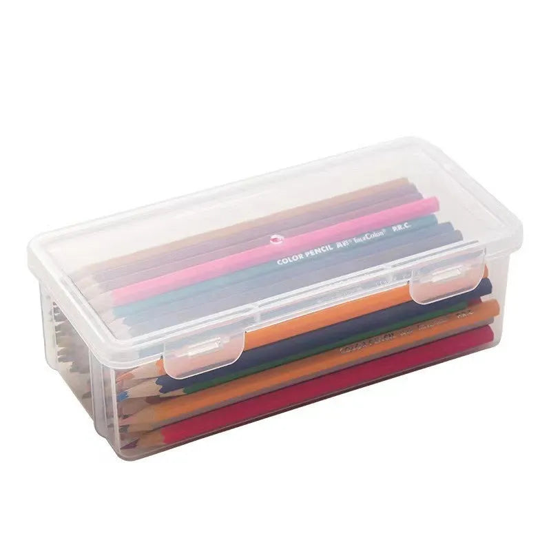 Large transparent plastic storage box full of coloured pencils and crayons