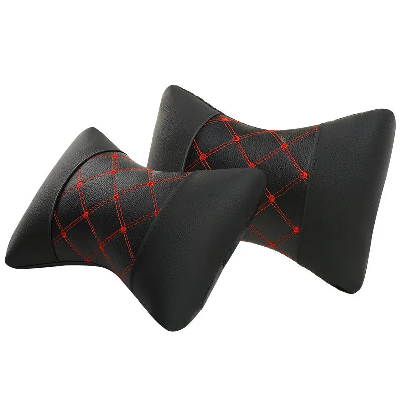 Black quilted diamond pattern car headrest pillow for cervical neck support.