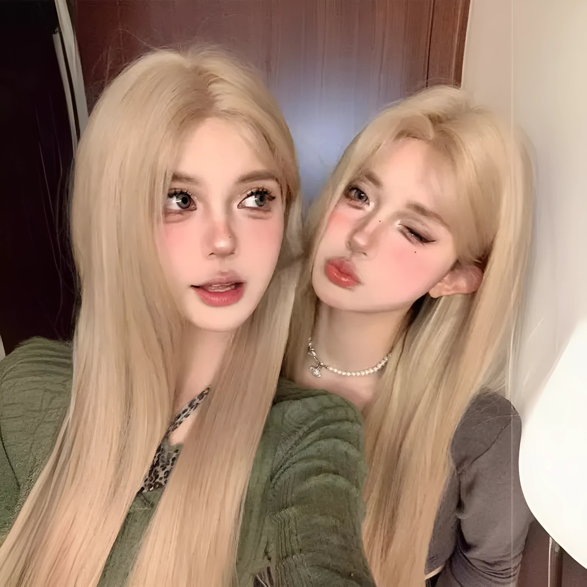 Full hair type women's long straight gray gold wig in milk tea blonde with hairnet on a mannequin