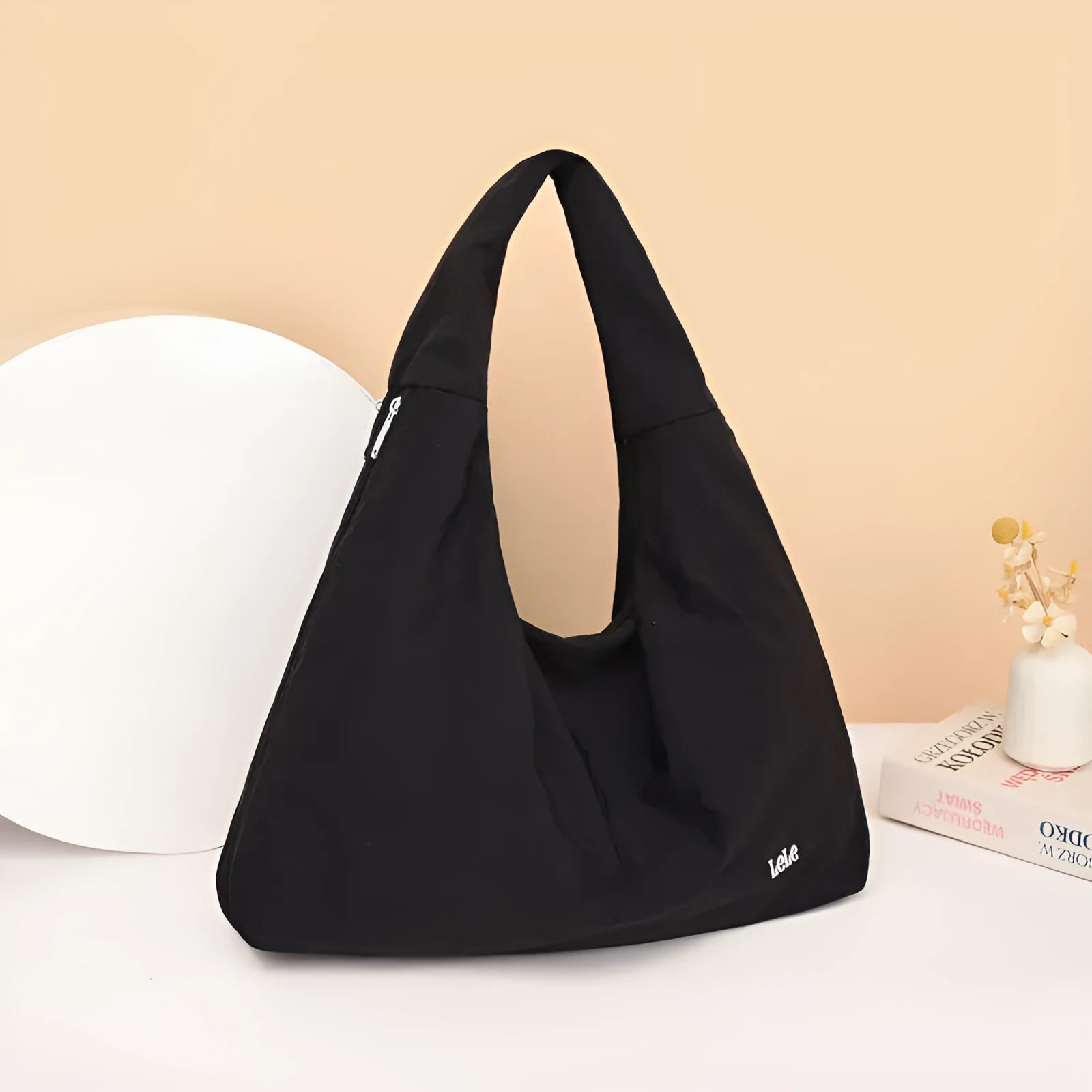Soft heart-shaped nylon underarm bag for women shown in black, blue, khaki, and yellow.