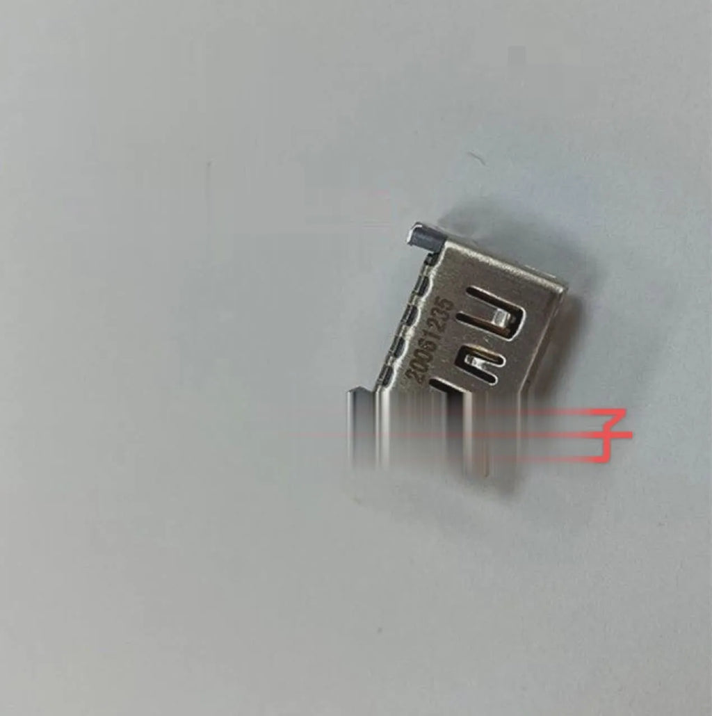 Silver coloured HDMI host socket interface for gaming console accessory.