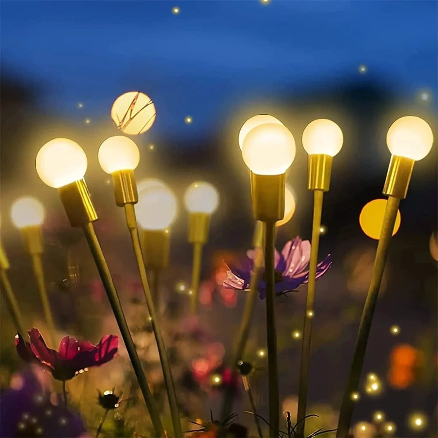 Solar-powered LED firefly garden spike light with multiple heads and a press-in ground plug on grass.