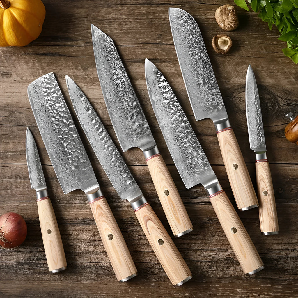 Damascus steel kitchen knife set of 7 with patterned blades and wooden handles on a dark surface