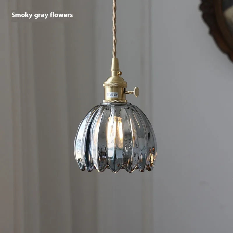 Vintage Nordic style glass flower chandelier with coloured shades in bedroom setting
