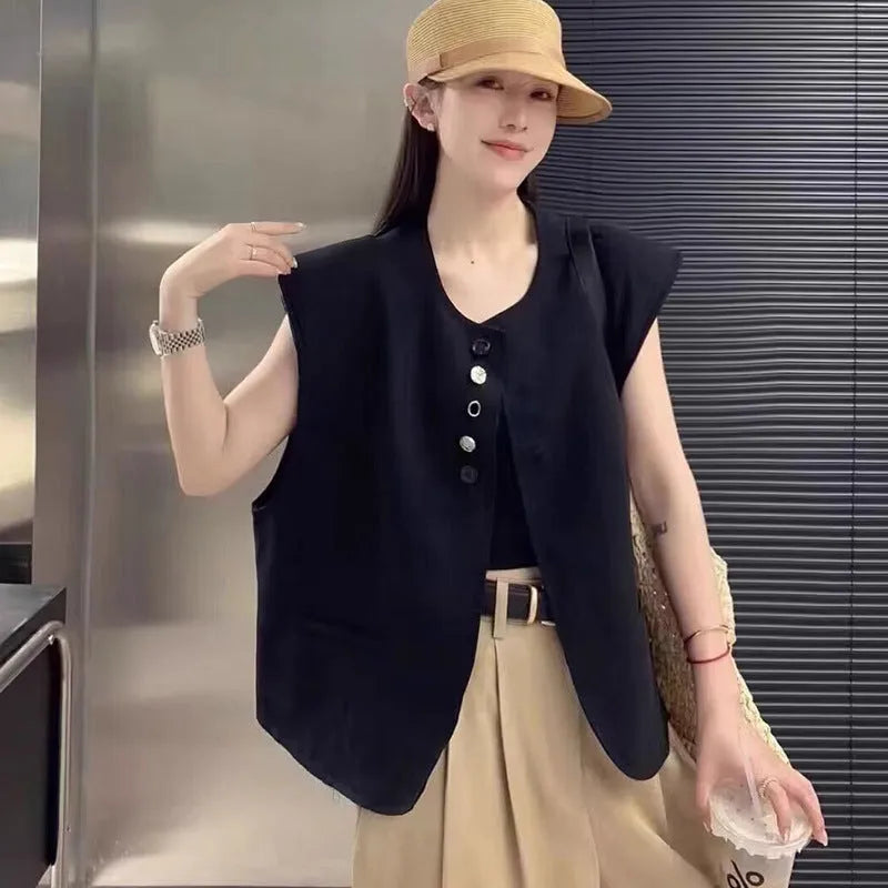 Women's loose fit vest with 40cm short length in milky white colour showing pocket detail